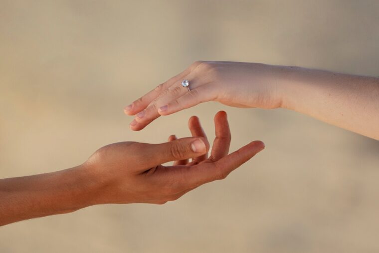 side-view-engaged-people-hands_23-2149480070